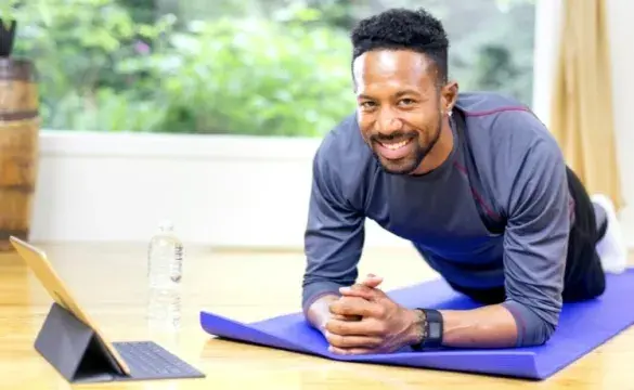 Man doing fitness exercise on mat