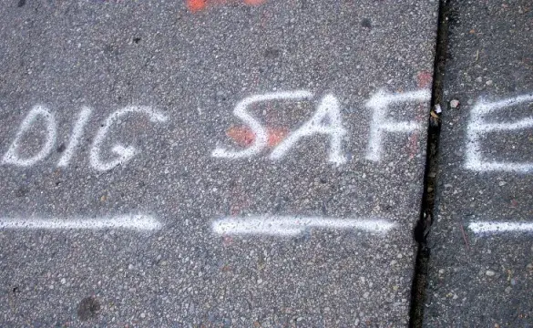 Dig safe Written on raod