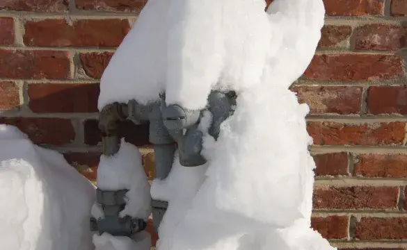 Electric meter covered in snow 