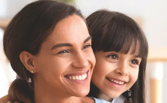 Mother and daughter smiling portrait