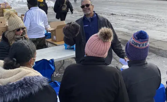 Community volunteers distributing supplies outdoor