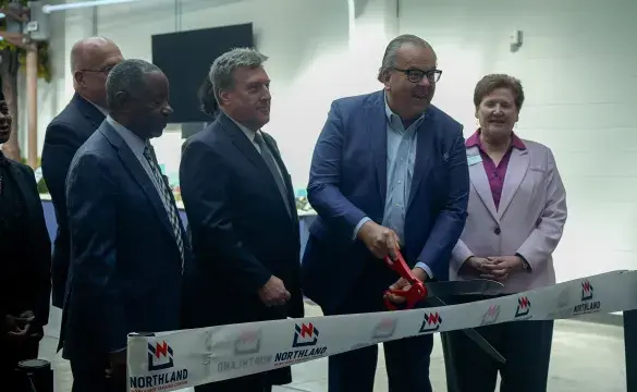 Ken Kujawa and leadership cutting ribbon at Northland