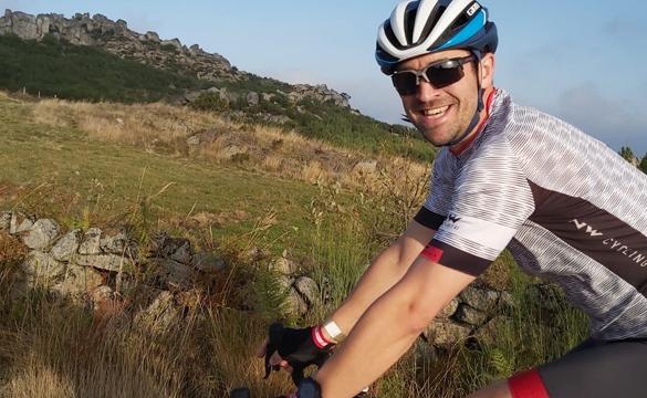 Close-up of National Grid's David Welling on his bike wearing a helmet