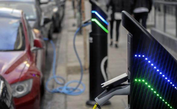 Electric car charging in street for National Grid article
