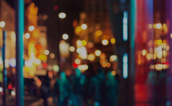 A blurred but well-lit cityscape