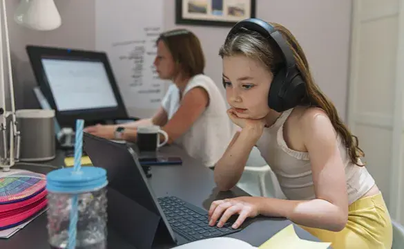 Young girl remote schooling in study with mother - used for National Grid story COVID-19 effect on electricity use