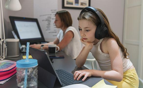 Young girl remote schooling in study with mother - used for National Grid story COVID-19 effect on electricity use
