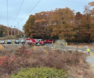 Trucks parked under power lines
