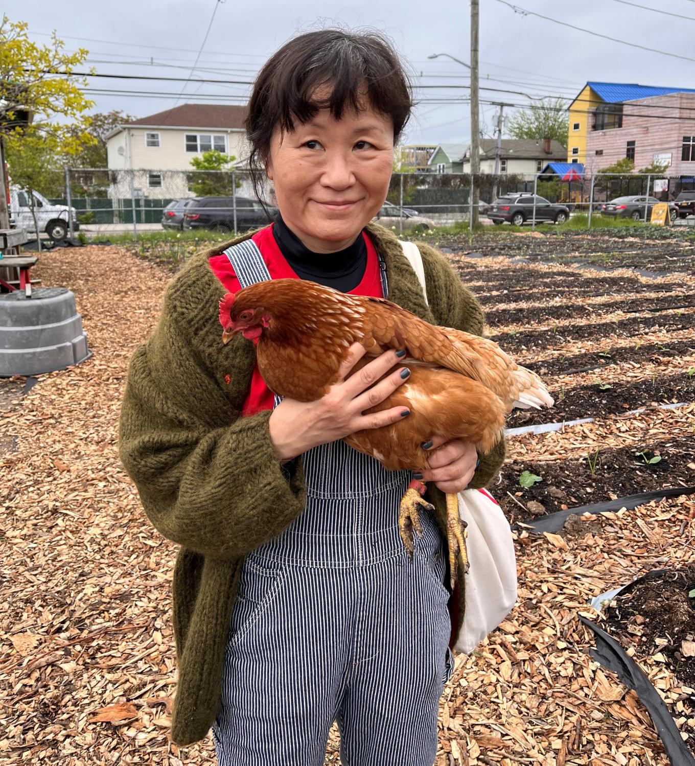 Women holding the hen