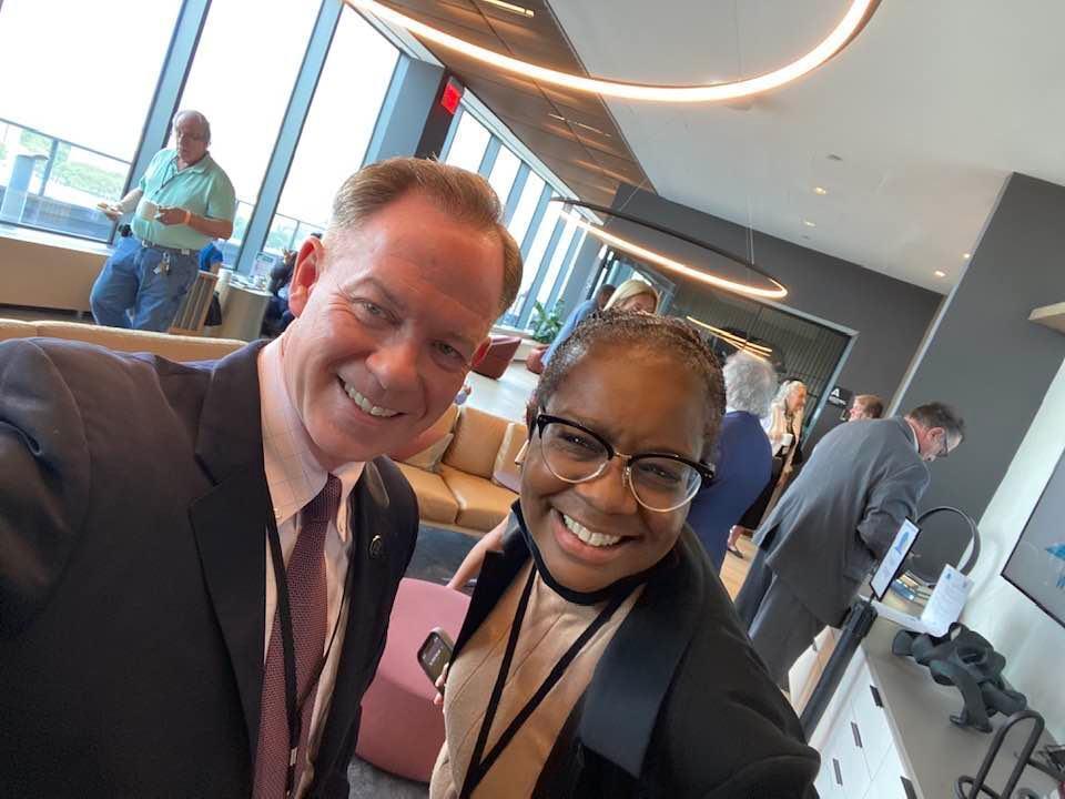 Two professionals taking selfie at event