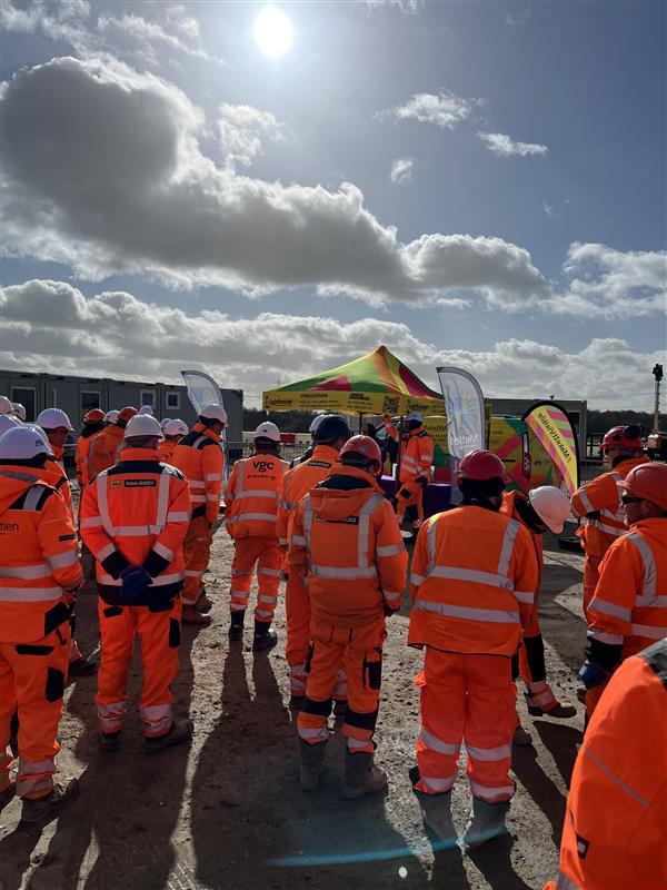 People Outside in Orange Construction Gear