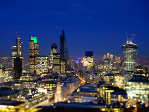 Aerial view of a lit up London skyline at night
