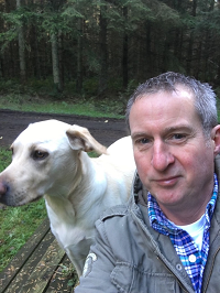 A selfie of a man and his dog.