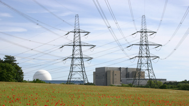 Poppy fields with pylons and overhead lines and Sizewell A and B nuclear power stations in the background