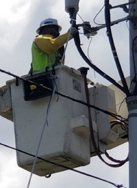 National Grid US lineworker Donald Lopes in bucket truck