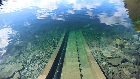 North Sea Link interconnector cable descending into the sea from the shore