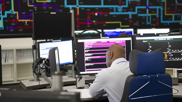 Man working at desk in control room - used for the National Grid story 'Working round the clock to power the nation at Easter'