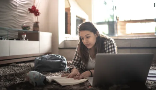 Woman with laptop inside her home