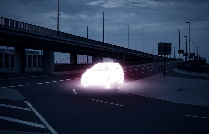 An EV lit up on dark street for National Grid article