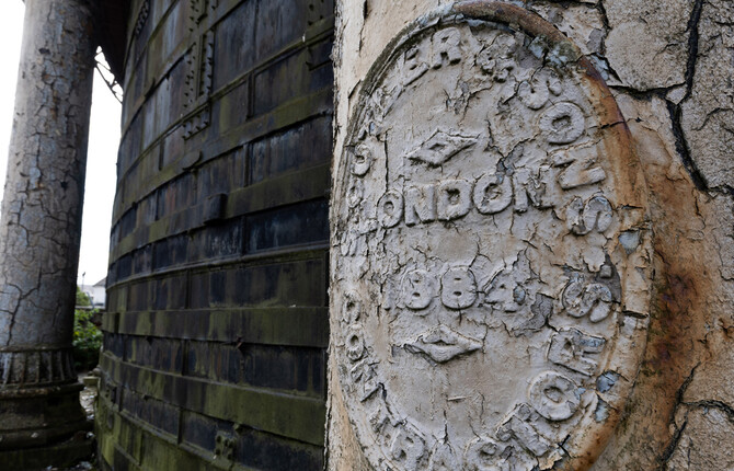 Close up of plaque on the Great Yarmouth Gas Holder with crumbling paint