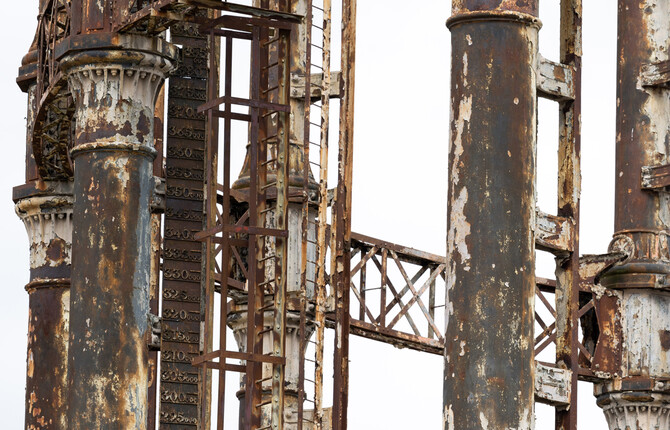 Close up of the Great Yarmouth Gas Holder pillars and ladder with crumbling paint