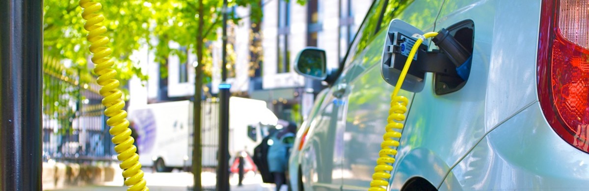 Electric car charging in street for National Grid article