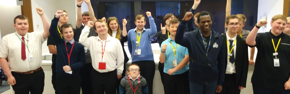 EmployAbility interns celebrating with hands in the air - used for the National Grid story 'EmployAbility supported internships: helping young people with learning disabilities get into employment'
