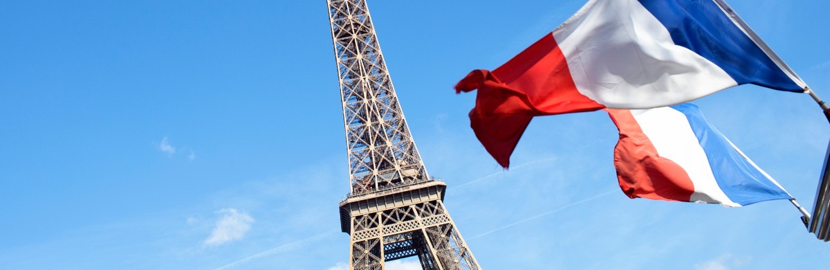 Eiffel Tower with french flag for National Grid Paris Agreement article