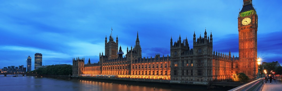Houses of Parliament and Big Ben in London at dusk, seen from Westminster Bridge