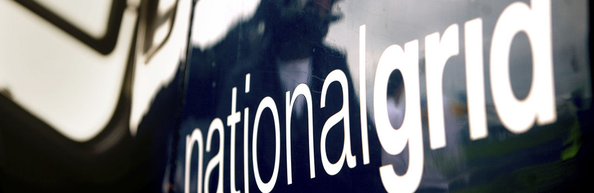 Man with headphones reflected on the side of National Grid helicopter - used for the National Grid story '8 things you (probably) didn’t know about National Grid'