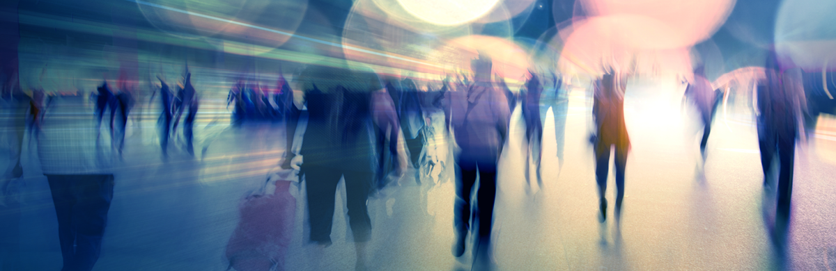People walking through a train station