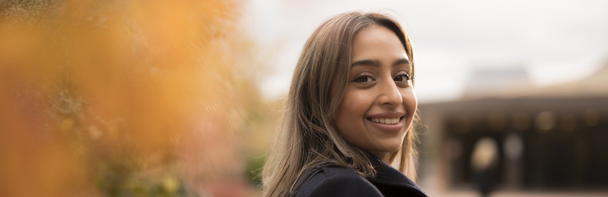 Young woman smiling and looking into camera for National Grid net zero workforce