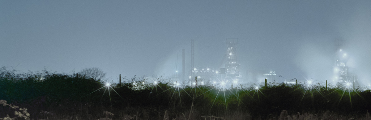 Lights from Steelworks in the distance at night