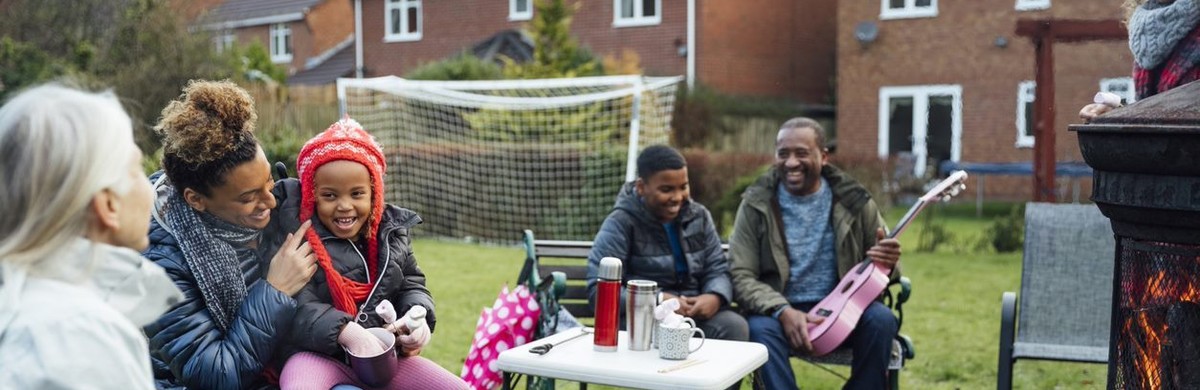Family socialising in garden