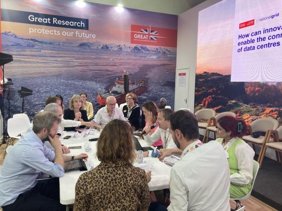 People Speaking Around a Table
