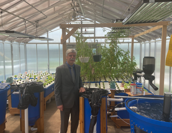 Paul Gister tours the greenhouse 