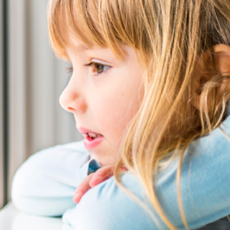 Girl looking out the window