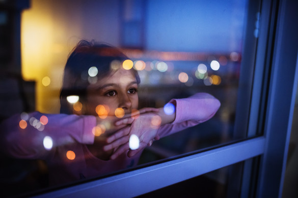 Girl looking out of window
