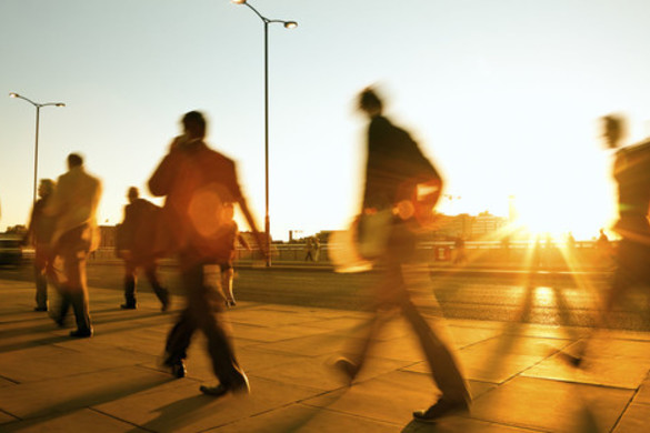 People walking at sunset