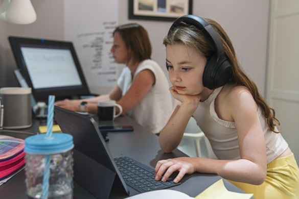 Young girl remote schooling in study with mother - used for National Grid story COVID-19 effect on electricity use