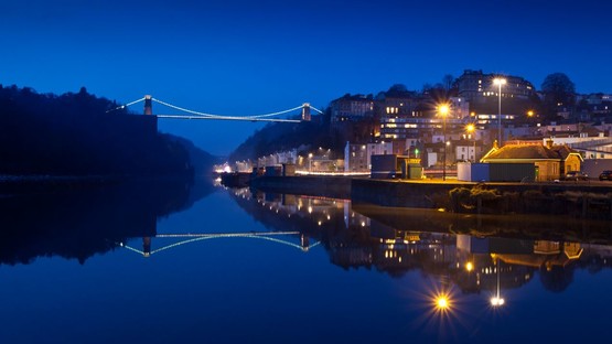 Lights from town reflecting on water