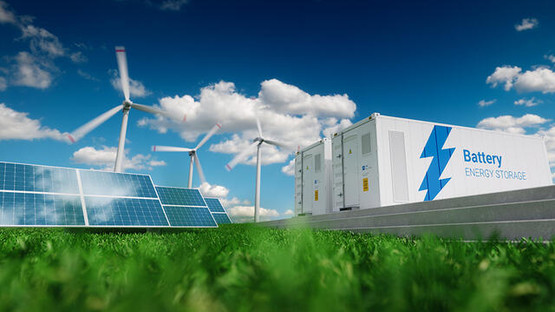 Solar panels, wind turbines and battery storage set against a blue sky with clouds