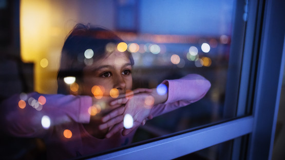Girl looking out of window