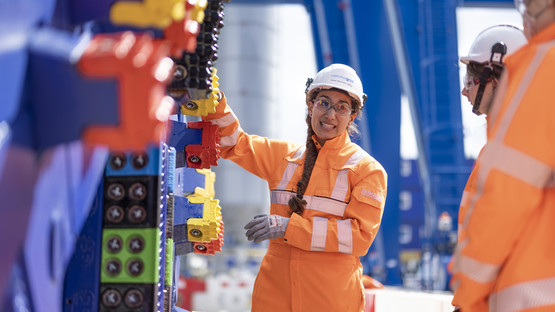 Woman Engineer on site wearing personal protective clothing