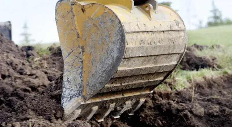 Digger digging dirt