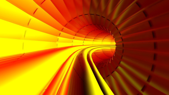 An inside view of a red, yellow and orange curved tunnel  